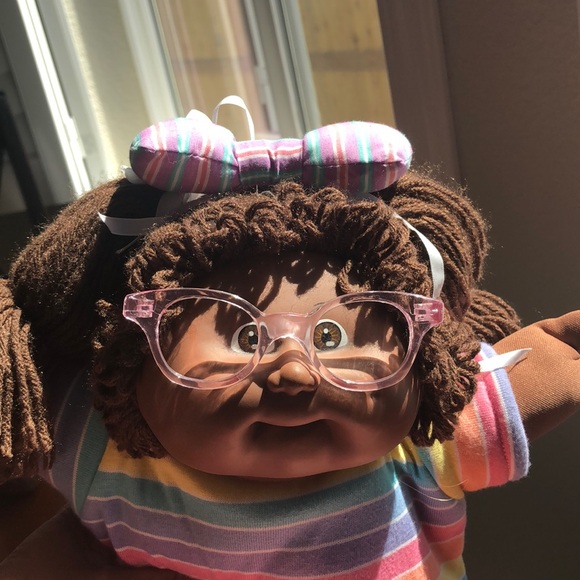 black cabbage patch doll with glasses